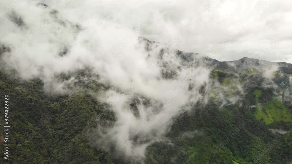Cocora Valley, Los Nevados National Natural Park, Salento, Colombia. Aerial View of Clouds Above Green Mountains