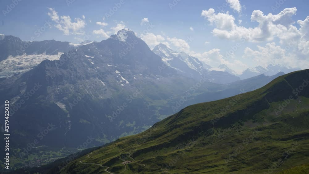 Clouds Moving In The Sky With Beautiful Landscape View Of The Northface Of Eiger And Mountain Jungfrau Near The Railway Of Kleine Scheidegg At The First Summit In Switzerland - timelapse Clouds Moving In The Sky With Beautiful Landscape View Of The Northface Of Eiger And Mountain Jungfrau Near The Railway Of Kleine Scheidegg At The First Summit In Switzerland - timelapse