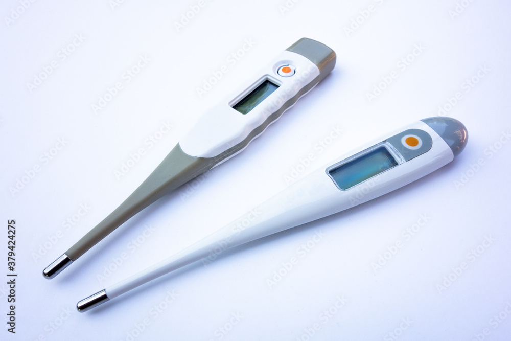 Electronic thermometer on white isolate. Place for logo Electronic thermometer on white isolate. Place for logo