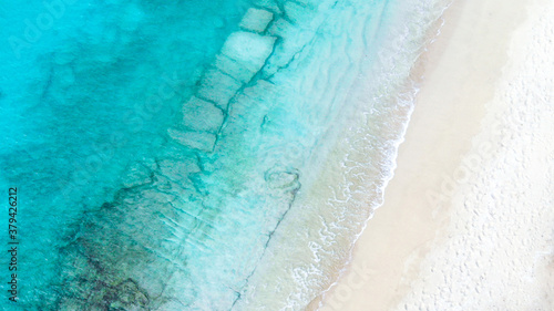 Turquoise water on sandy beach in the Caribbean