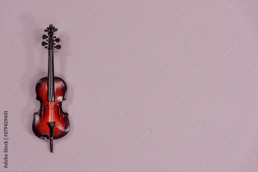 Miniature of a cello with space for writing