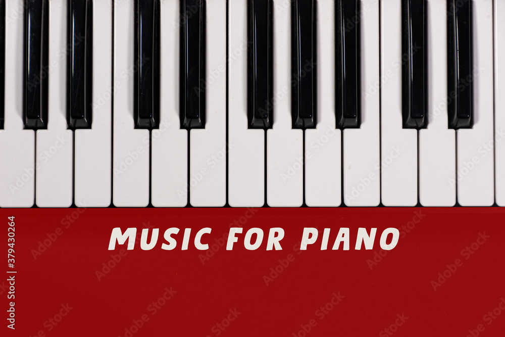 Piano keyboard isolated on colorful background with space for writing. Competition concept
