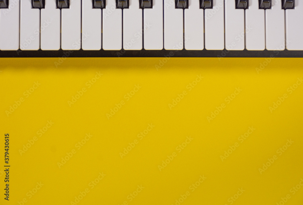 Piano keyboard isolated on colorful background with space for writing. Competition concept