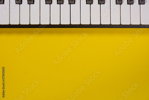 Obraz na płótnie Piano keyboard isolated on colorful background with space for writing. Competition concept w salonie