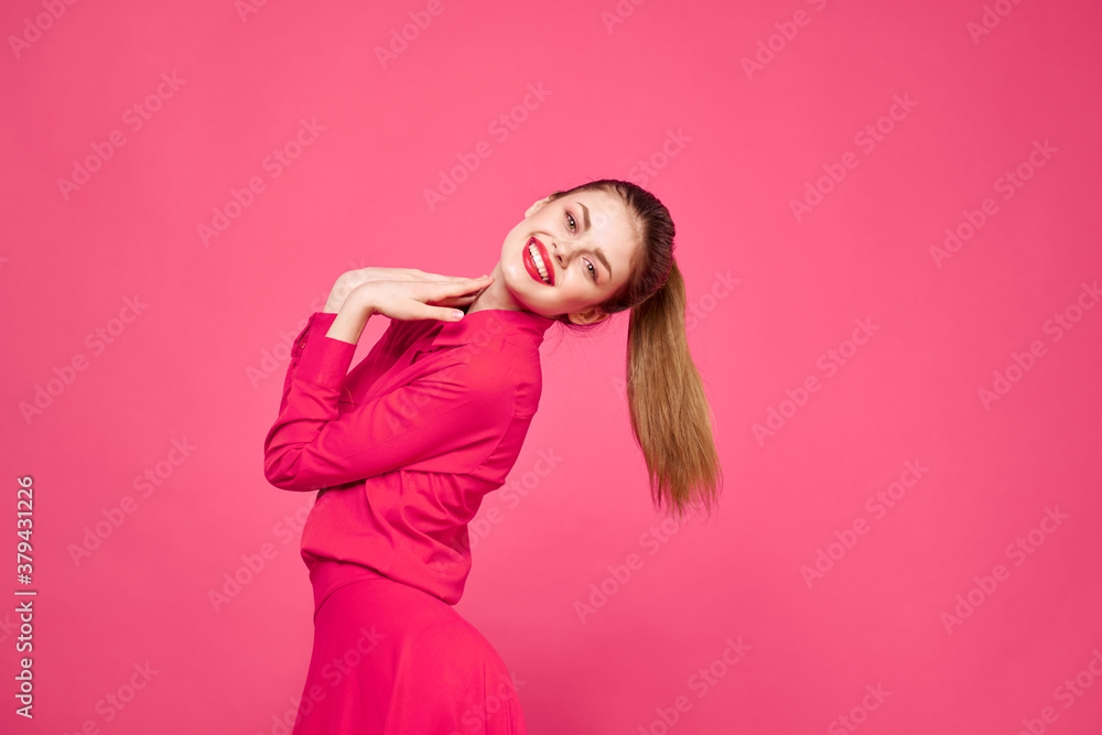 Woman on a pink background in fashionable clothes and bright makeup hairstyle model Copy Space Woman on a pink background in fashionable clothes and bright makeup hairstyle model Copy Space