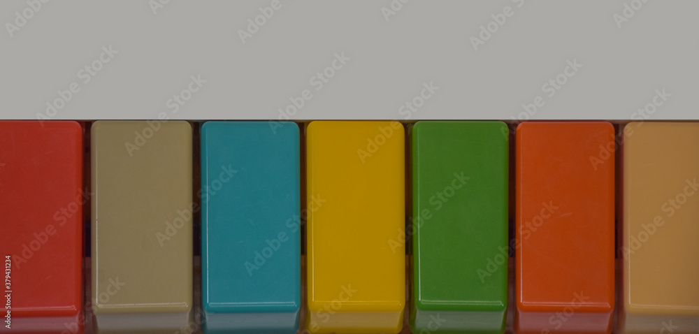 Colorful keys of a toy keyboards with space for writing