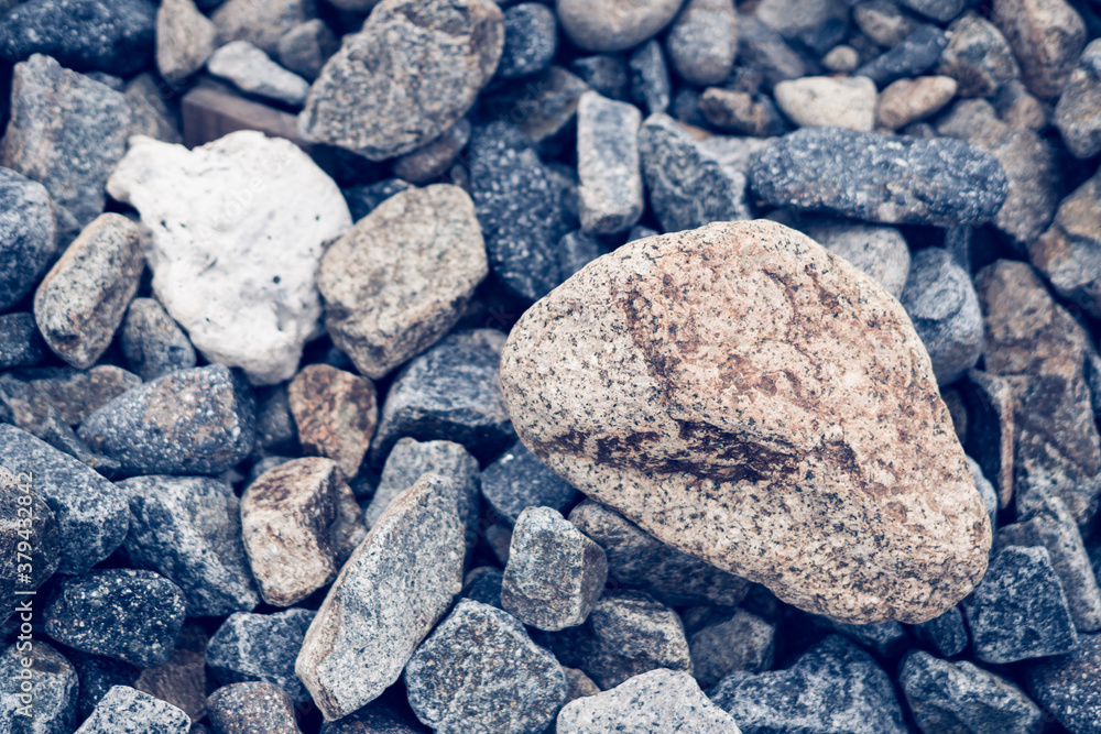Small and big smooth round pebbles, sea dry stones, multicolour gray gravel. Abstract Composition Textured background. Ideal for web banner design Small and big smooth round pebbles, sea dry stones, multicolour gray gravel. Abstract Composition Textured background. Ideal for web banner design