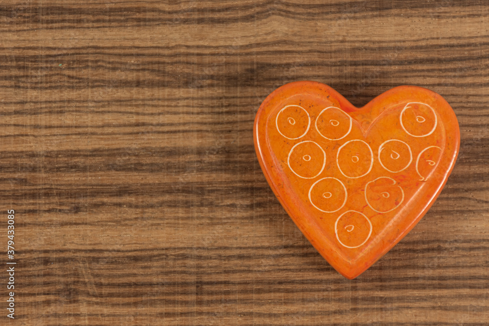 Orange heart on background with space for writing Orange heart on background with space for writing