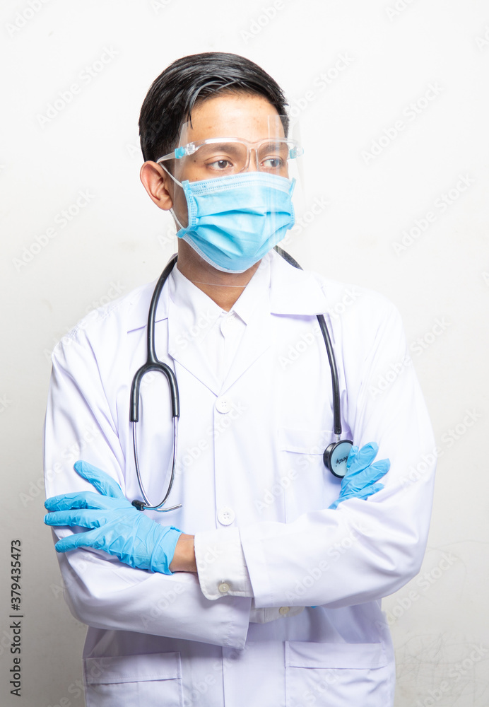 Doctor Man on blur hospital laboratory panoramic blue background. COVID-19 virus epidemic outbreak to Coronavirus pandemic disease global recession wide concept for social scientist vaccine Doctor Man on blur hospital laboratory panoramic blue background. COVID-19 virus epidemic outbreak to Coronavirus pandemic disease global recession wide concept for social scientist vaccine