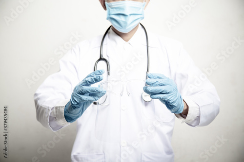 Fotografi Doctor Man on blur hospital laboratory panoramic blue background