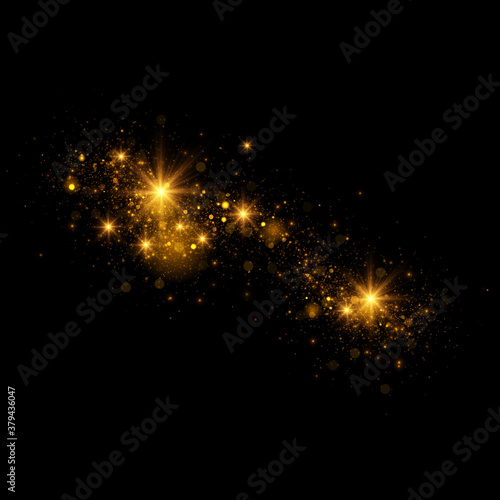 Transparent golden light effect. Magical sparkles isolated on black background.