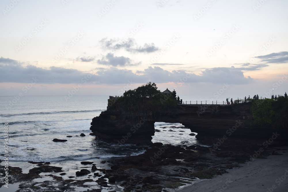 beautiful sea and temple on the rocks in Bali, indonesia, no people in a relaxing landscape while traveling at evening