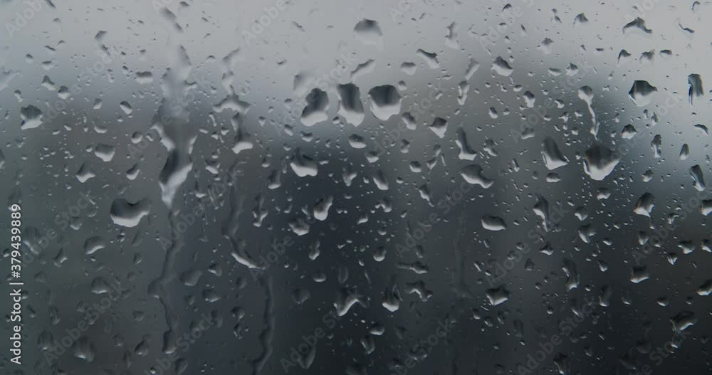 real rain drops sliding on window glass real rain drops sliding on window glass