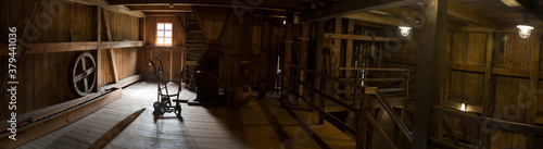 Old mill inside. Old wooden mill panorama from inside. Old mill interior.
