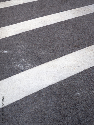 Wallpaper Mural Closeup of a tar or asphalt pavement texture with white lines painted on asphalt road Torontodigital.ca