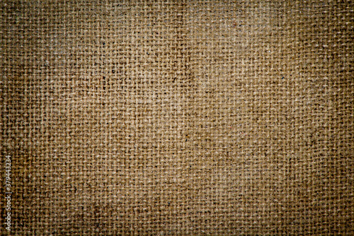 Grunge burlap sacking texture closeup photo background.