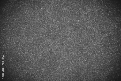 Grey pile fabric texture closeup photo background.