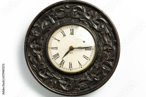 old wall clock with decorative wooden valance
