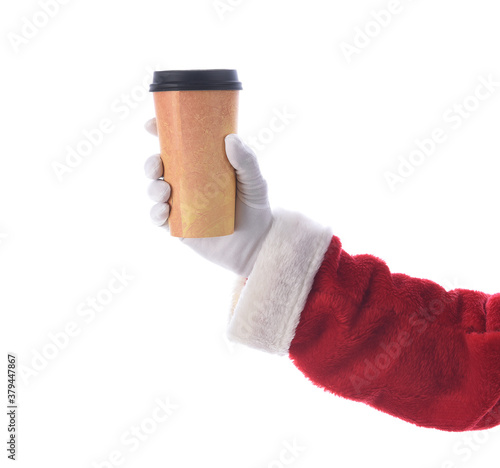 Santa Claus hand and arm holiding a disposabel cup of Coffee over white. photo