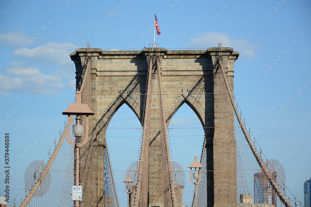 Fototapeta premium New York, NY, USA - June 3, 2019: Brooklyn Bridge connects Manhattan and Brooklyn