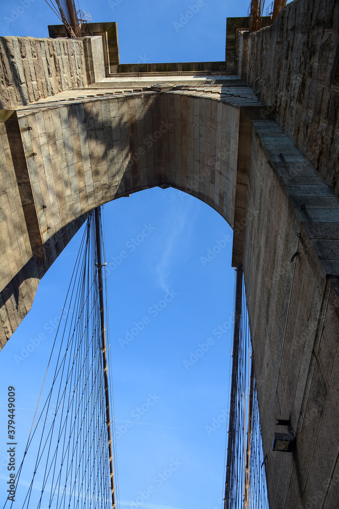 Fototapeta premium New York, NY, USA - June 3, 2019: Brooklyn Bridge connects Manhattan and Brooklyn