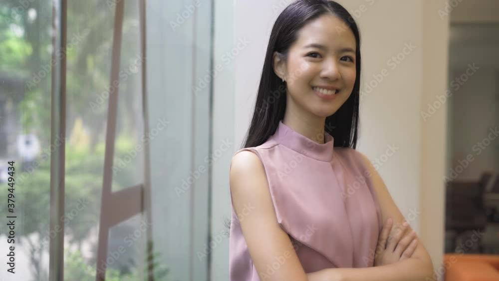 Young Asian businesswoman having arms folded in the office building. Chinese Korean Asia smart lady with arms crossed portrait video - 4K High Quality Footage Young Asian businesswoman having arms folded in the office building. Chinese Korean Asia smart lady with arms crossed portrait video - 4K High Quality Footage