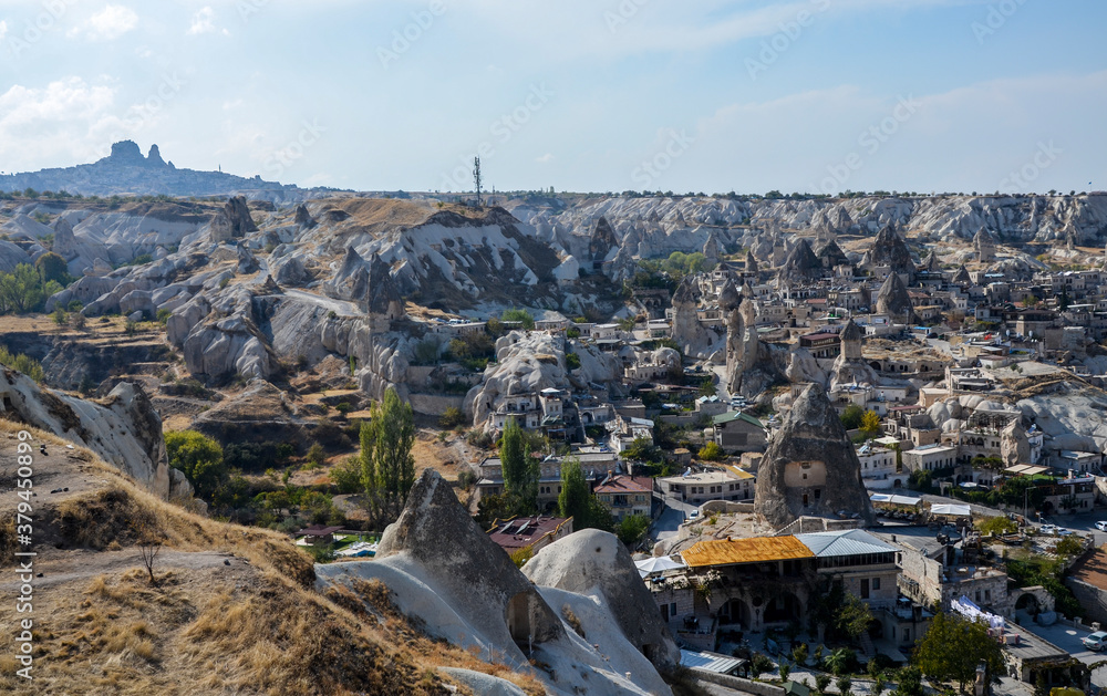 Above view of Goreme town with ancient houses and fairy chimneys in Cappadocia Turkey. Travel concept