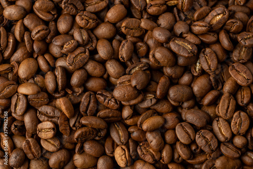 Close-up studio shot of freshly roasted espresso coffee beans.