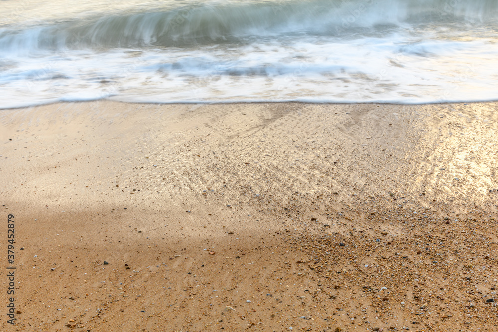 Sandy beach along the Atlantic coast in a summer evening. Sandy beach along the Atlantic coast in a summer evening.