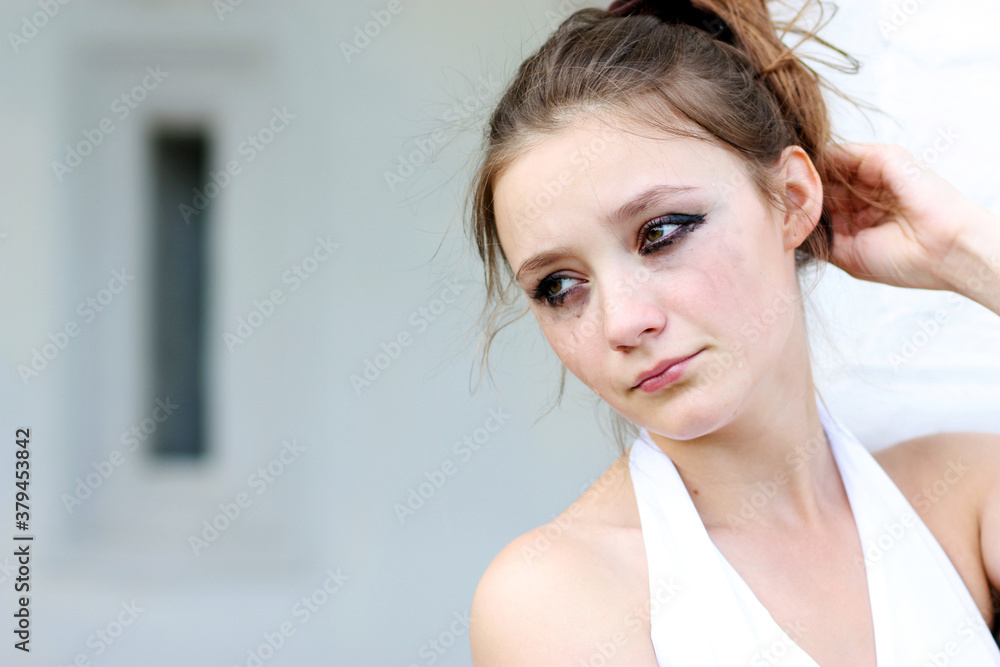 Young woman started running mascara from tears Young woman started running mascara from tears