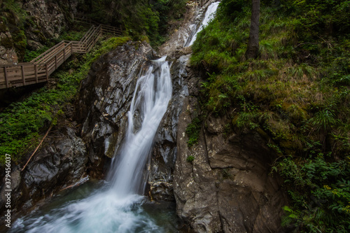 beautiful long waterfall in a gorge