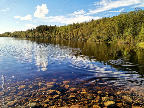 Northern beauty on the Ura river, Murmansk region. River, forest, nature.