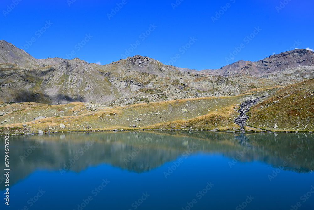 Reflections in the round lake. Névache valley near Briançon. Reflections in the round lake. Névache valley near Briançon.