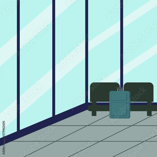 Room with glass walls, armchairs and a suitcase