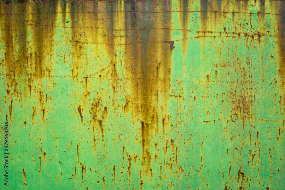 rust texture on metal door with green paint