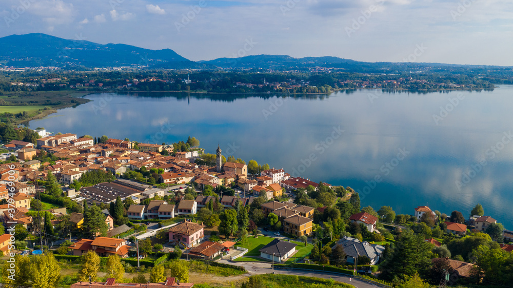 Aerial view from the drone of the landscape of a small town on the shores of lake Como, Italy.