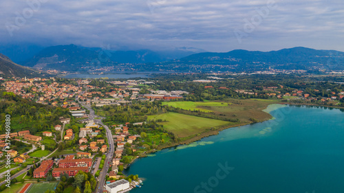 Aerial view from the drone of the landscape of a small town on the shores of lake Como, Italy.