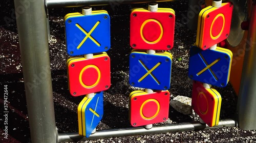 game of three of a kind with colored wooden blocks on games in a public park. conceptual image for risk, luck photo