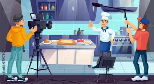Professional master chef in uniform cooking pizza at restaurant kitchen. Cameraman television crew recording culinary tv show program. Culinary course, training class, video blog live broadcasting