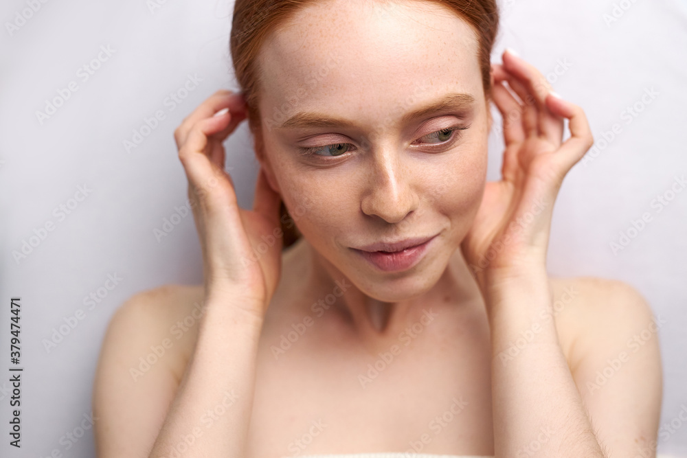 portrait of cute woman before ear piercing, naked lady puts her hair behind her ear and looks away portrait of cute woman before ear piercing, naked lady puts her hair behind her ear and looks away