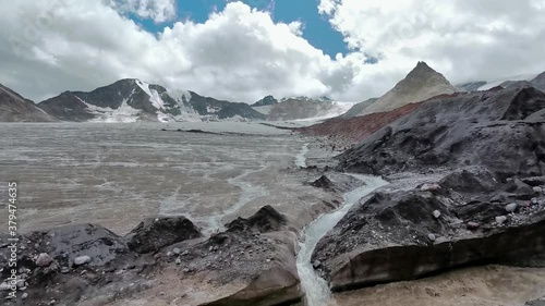Mountain landscape with glaciers and river near Elbrus on Caucasus, Russia