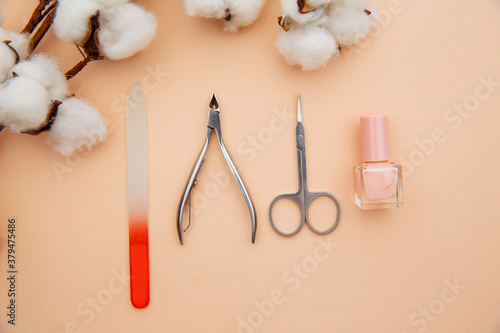 Manicure set on a pink table. Concept of beauty care.