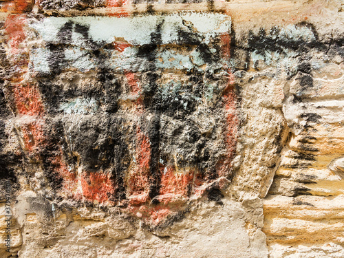 Multi-colored old paint on stone surface, as textured background. Vintage colorful background texture. Interior design texture and balckgound