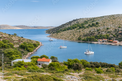 Top view of the bay with yachts and houses of the village near the island of Lavsa in the Adriatic sea in Croatia photo