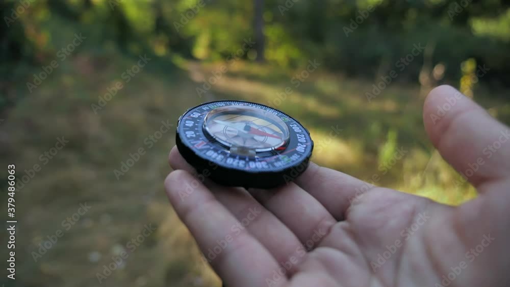 Female forwarder hands holding a compass and looking for direction. Orientation in forest 4k close-up in motion 4k Female forwarder hands holding a compass and looking for direction. Orientation in forest 4k close-up in motion 4k