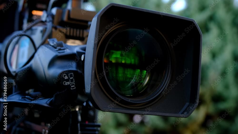 Professional broadcast camera in outdoor studio shooting video. Broadcasting industry. Professional broadcast camera in outdoor studio shooting video. Broadcasting industry.
