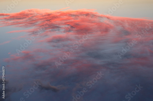 Fiery clouds during dusk as seen from the top of a mountain