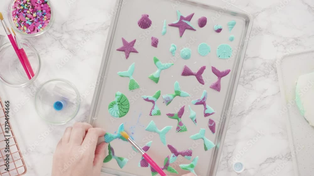 Step by step. Making chocolate mermaid tails in a silicone mold to decorate vanilla cupcakes. Step by step. Making chocolate mermaid tails in a silicone mold to decorate vanilla cupcakes.