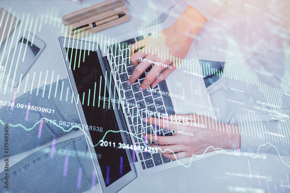 Double exposure of woman hands working on computer and forex graph hologram drawing. Top View. Financial analysis concept. Double exposure of woman hands working on computer and forex graph hologram drawing. Top View. Financial analysis concept.