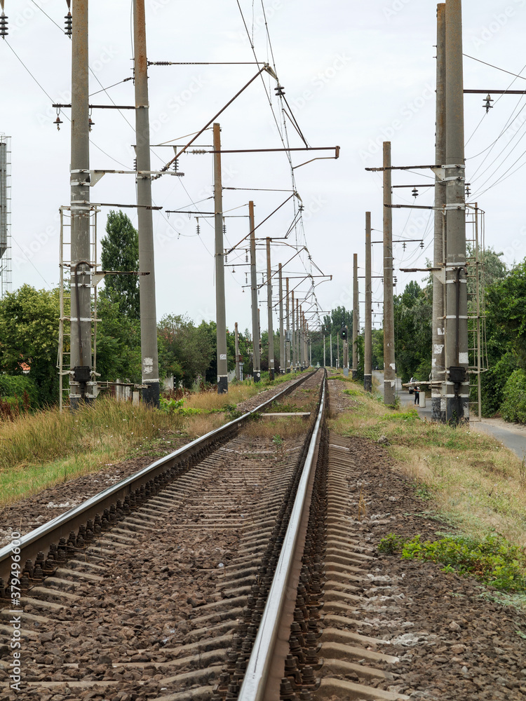 Railway or railroad tracks for train transportation. Lower angle view of empty train tracks. Curving Railway.